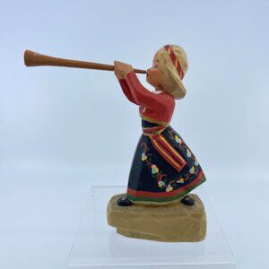 hand carved henning prillaguri figurine (girl with horn) in tradirtional dress